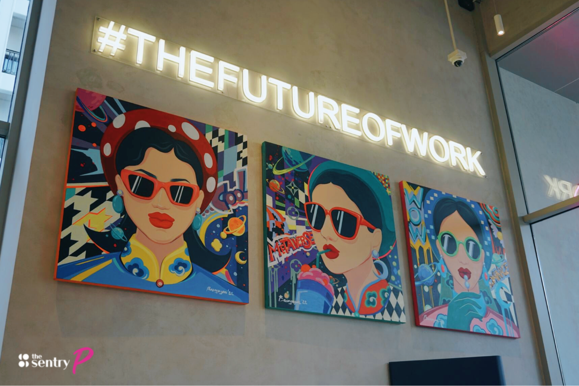 Colorful pop art portraits with a neon sign "#THEFUTUREOFWORK" above.