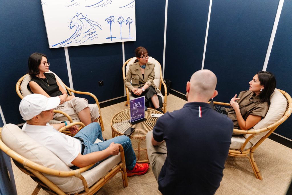 A person booking a meeting room in a modern office. 