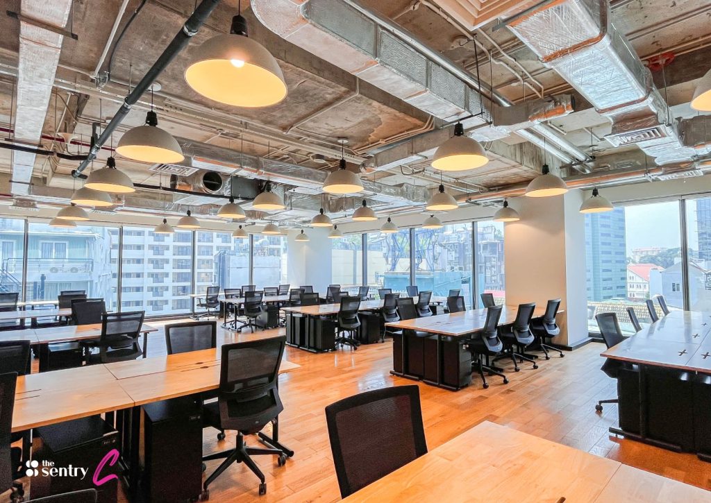 A clean, minimalist open office with a professional setup. 