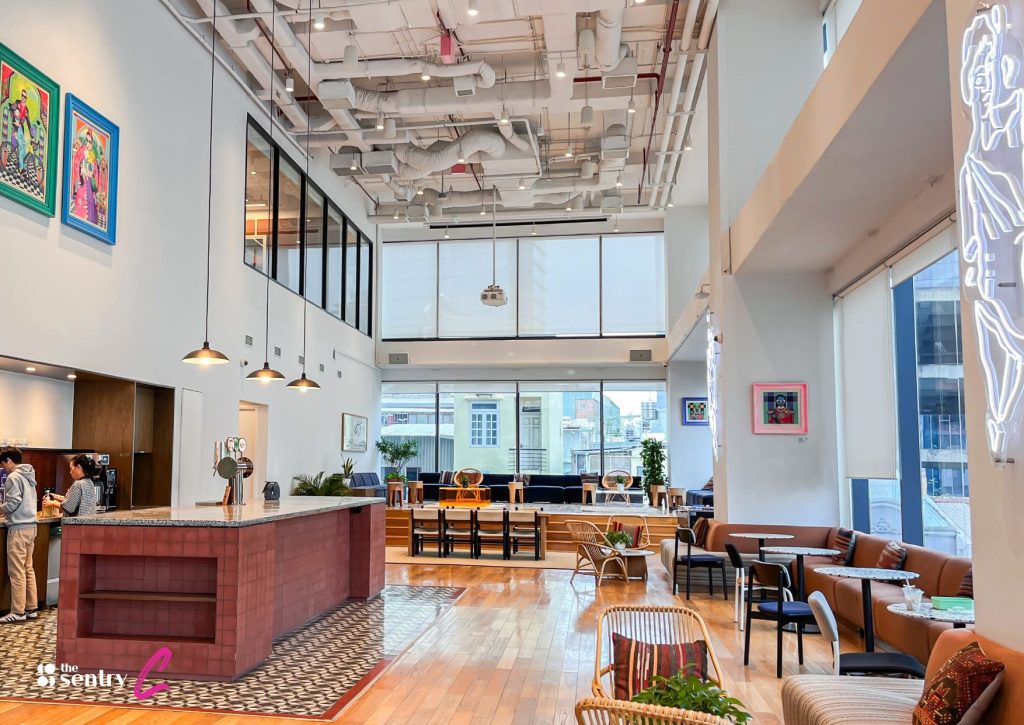 A comfortable and stylish lounge area with a city view. 