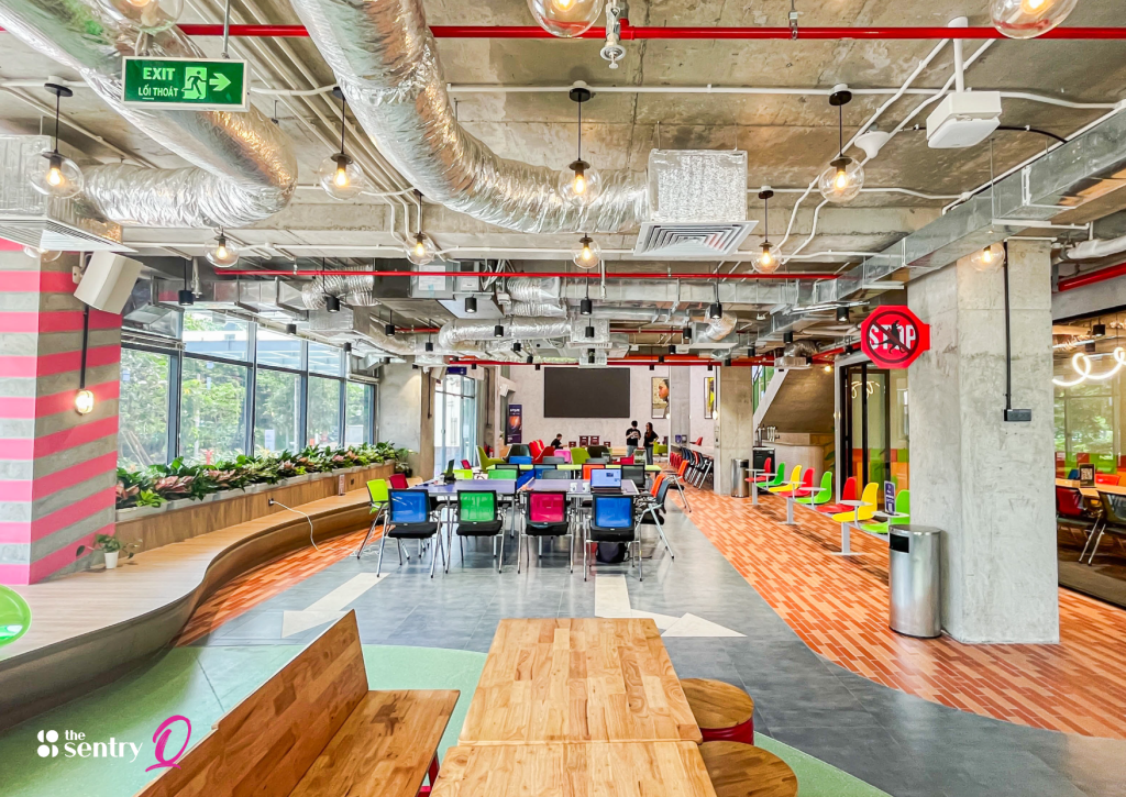 A wide view of a beautifully designed coworking space with a professional and high-end atmosphere. 