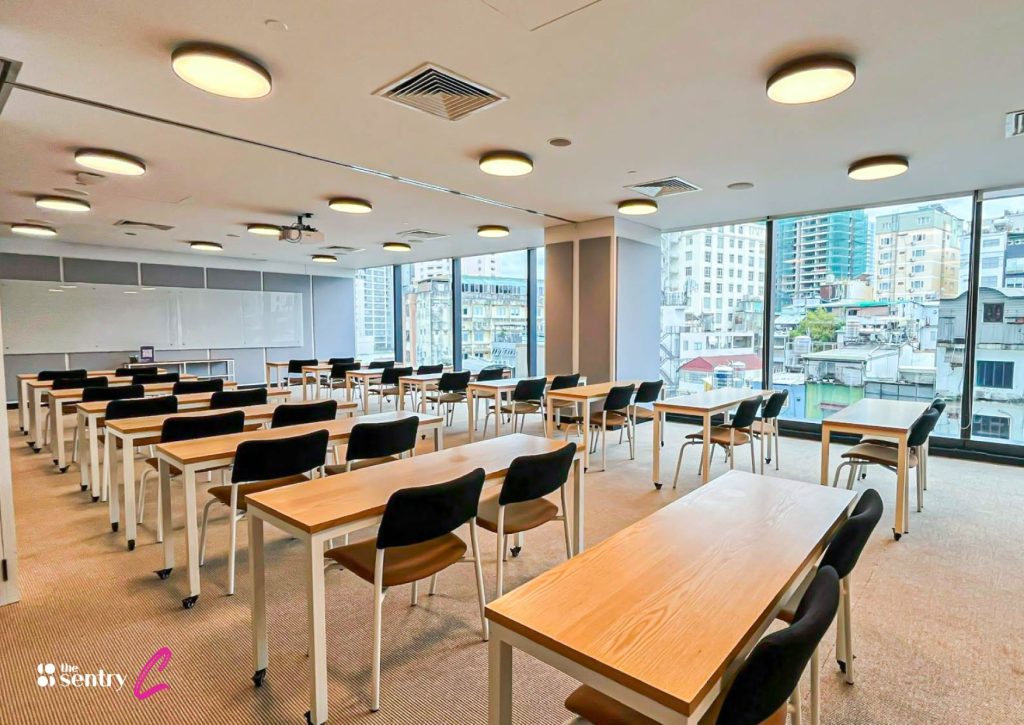 A luxurious and professional boardroom with a stunning city view through large windows.