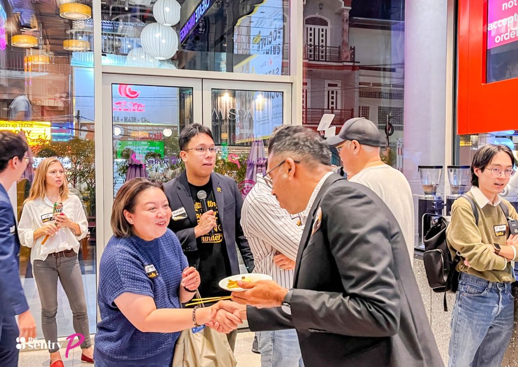 Colleagues happily collaborating in a shared lounge at The Sentry.
