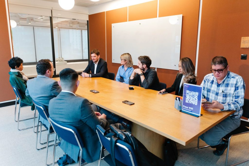 A team brainstorming with whiteboards in a Sentry meeting room.