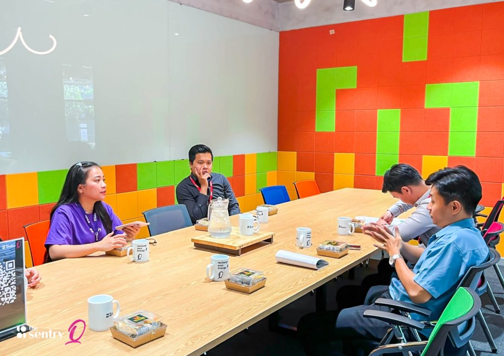 A team brainstorming together in a Sentry meeting room.