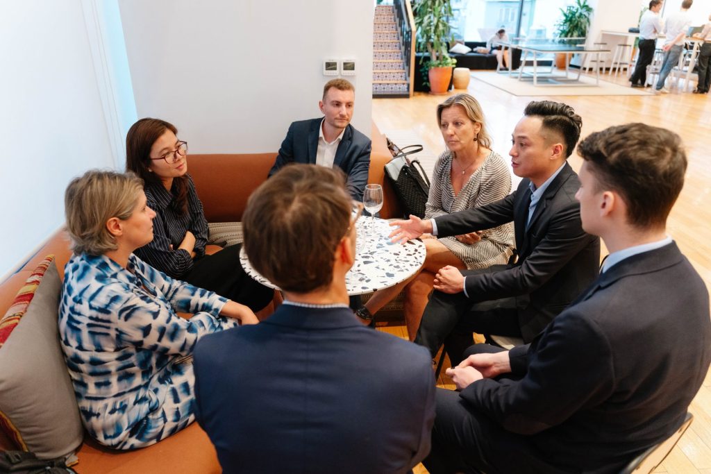 Team members collaborating in a comfortable lounge at The Sentry.