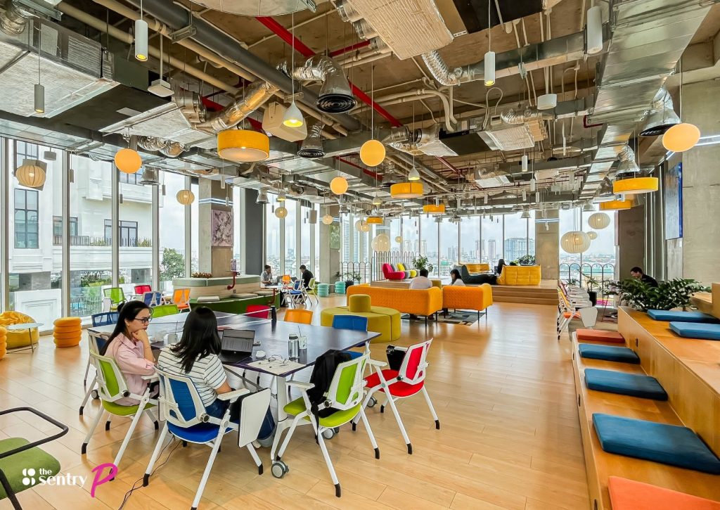 A vibrant community working together in The Sentry's workspace.