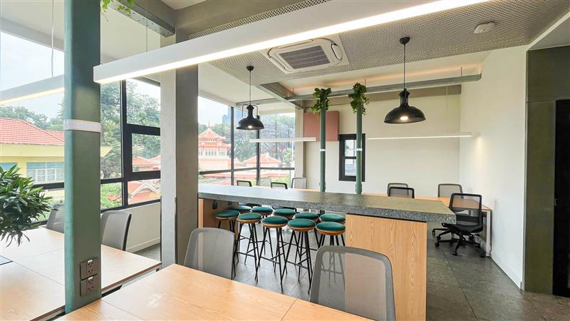 Clean, bright private office at The Sentry with a city view.