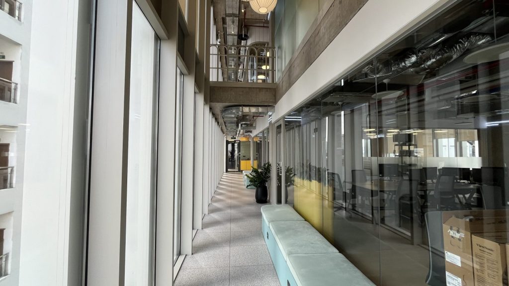 Sleek, modern corridor leading to private serviced offices.