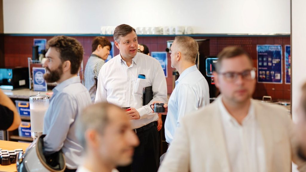 Members enjoying coffee in The Sentry’s vibrant pantry area.