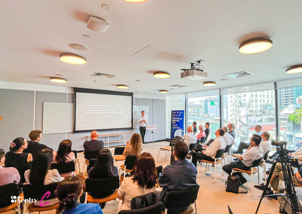 A team brainstorming at a whiteboard in a Sentry meeting room.