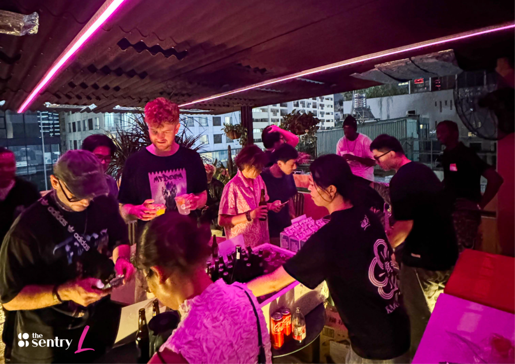 A group of digital nomads sharing a meal and chatting in a communal kitchen.