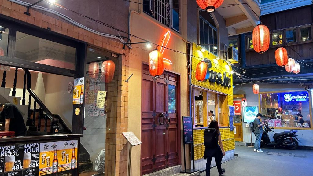 The sleek, modern entrance of The Sentry L tucked away in a quiet alley.