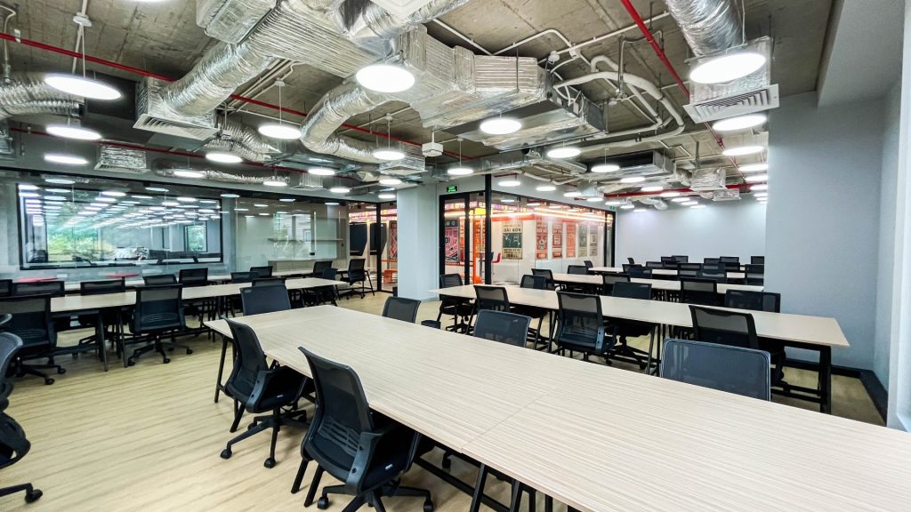 Professionals collaborating at a shared desk.