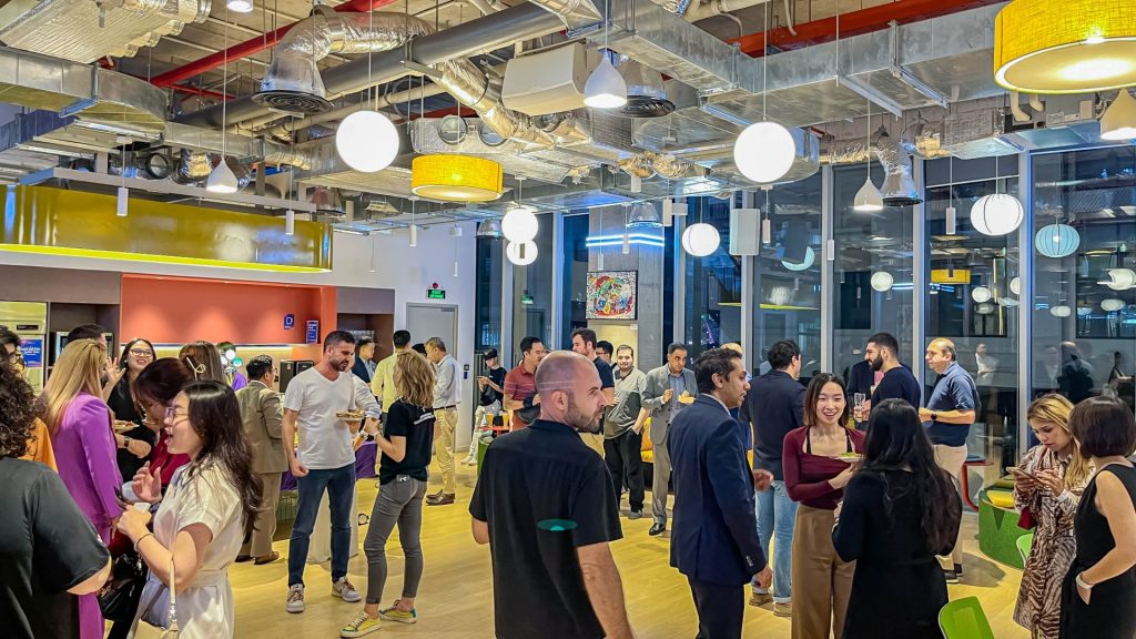 A crowded networking event in The Sentry's main event hall.