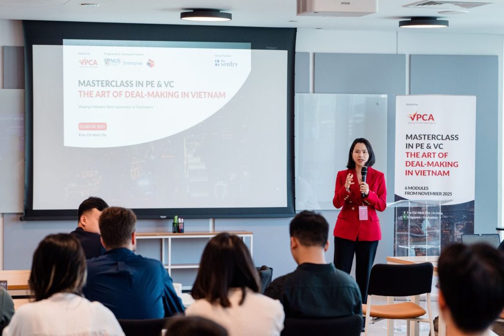 Person using video conferencing gear in a phone booth.