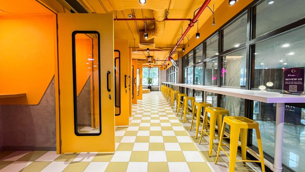 Soundproof phone booth and modern office amenities.