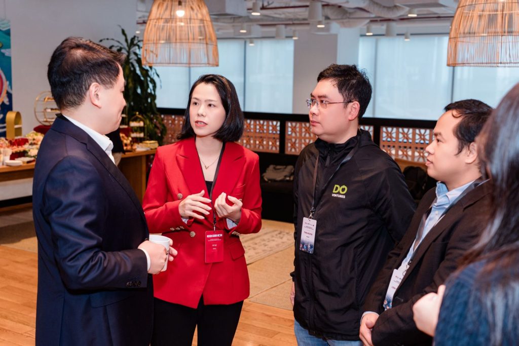 People chatting and drinking coffee in a pantry or communal cafe area within the coworking space.