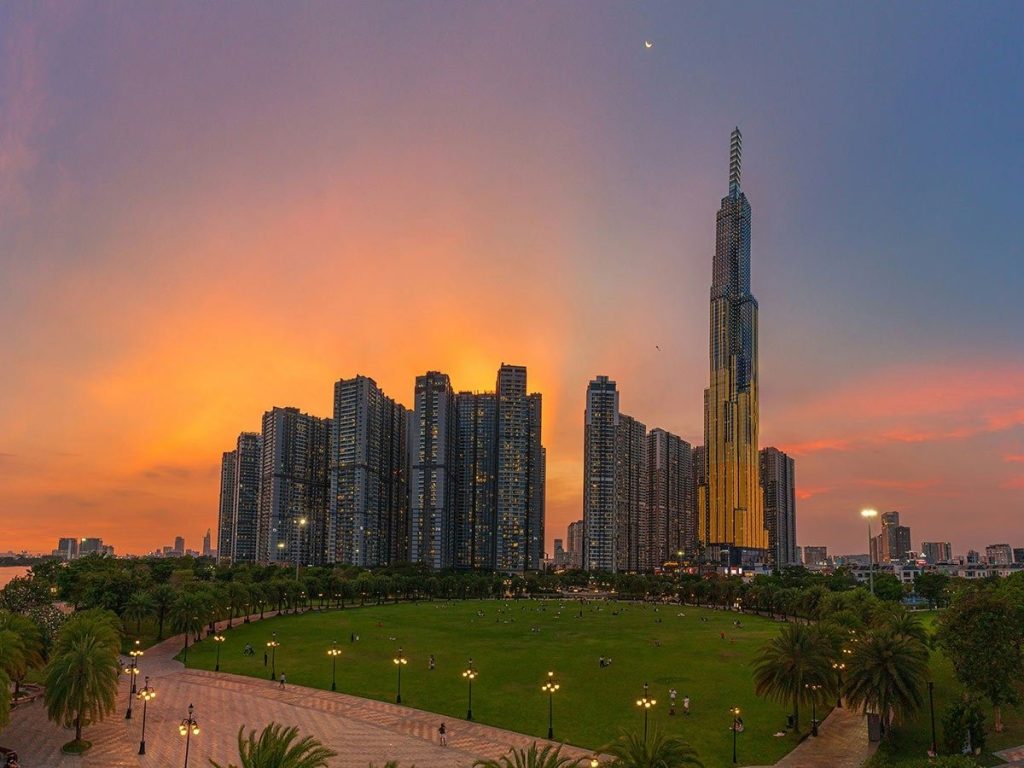  The towering Landmark 81 building rising above a lush park.