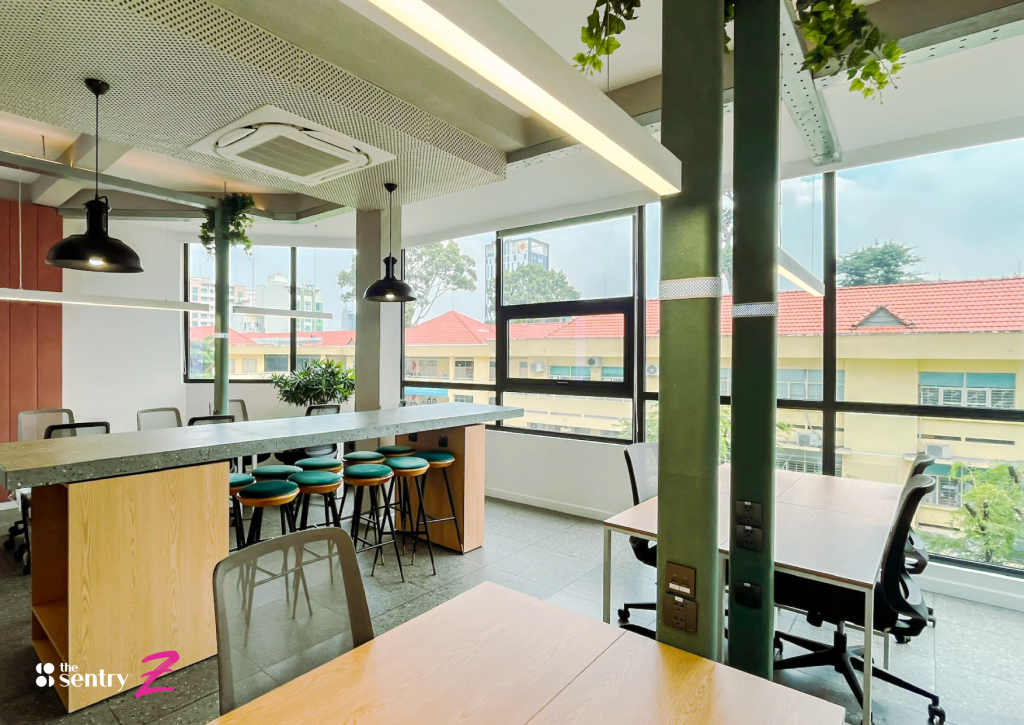 Large floor-to-ceiling windows in an office space looking out onto a city view.