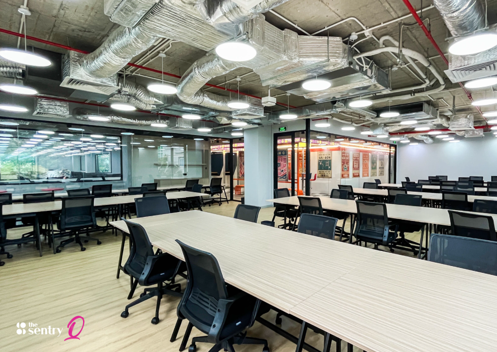 A specific desk setup featuring a monitor, personal items, and a filing cabinet.