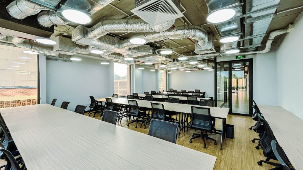 A wide view of a sleek corridor at The Sentry, with private offices and dedicated desks