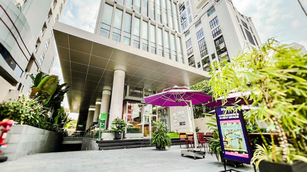 A large, branded corporate glass entrance.