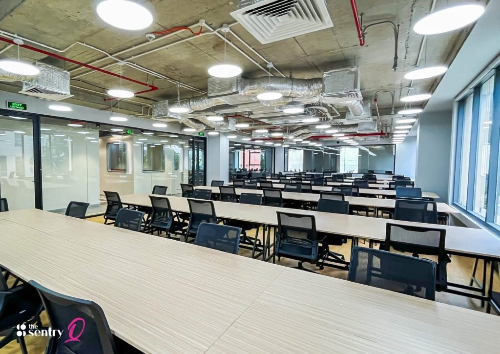 A large, fully furnished private office suite with desks and ergonomic chairs.