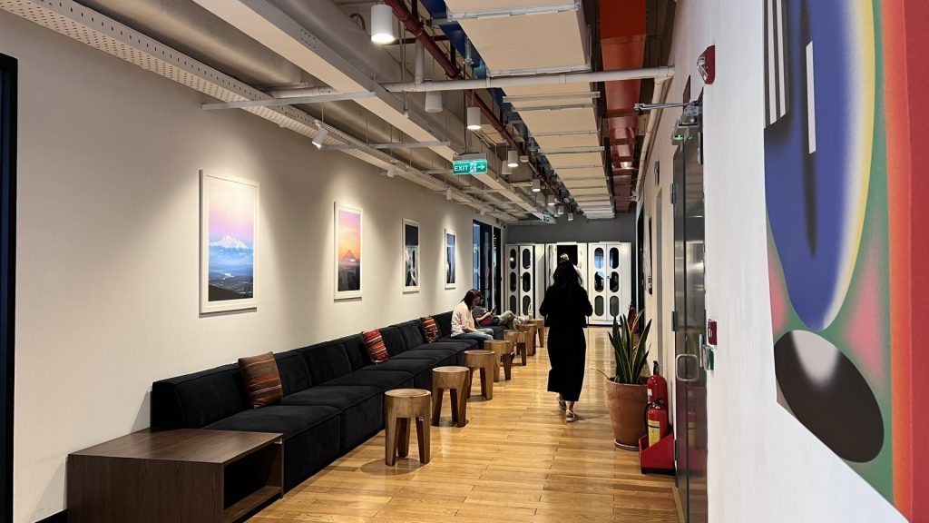 A welcoming and professional workspace corridor leading to various private office suites.