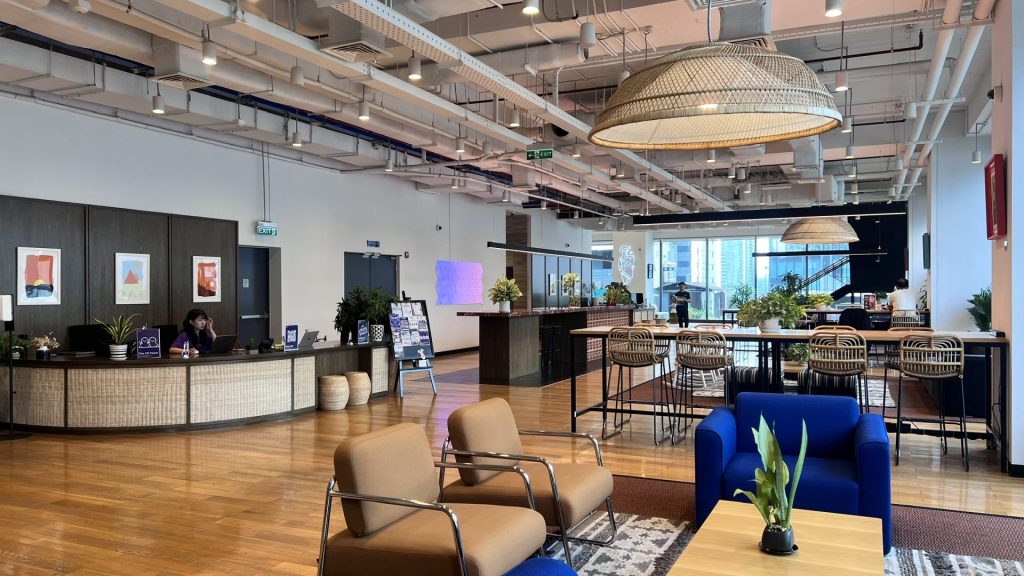A professional reception and lobby area at a premium District 1 coworking location.