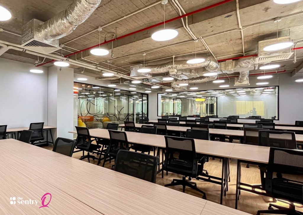 Secure, glass-enclosed private office with internal blinds.