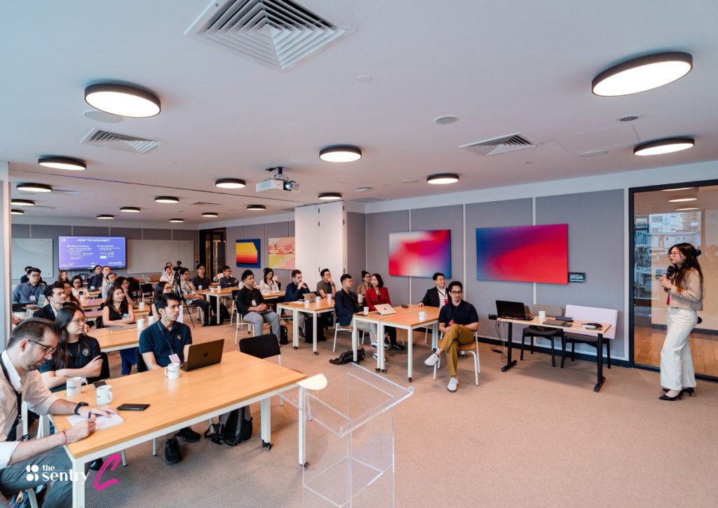 A busy coworking floor filled with workers during peak hours