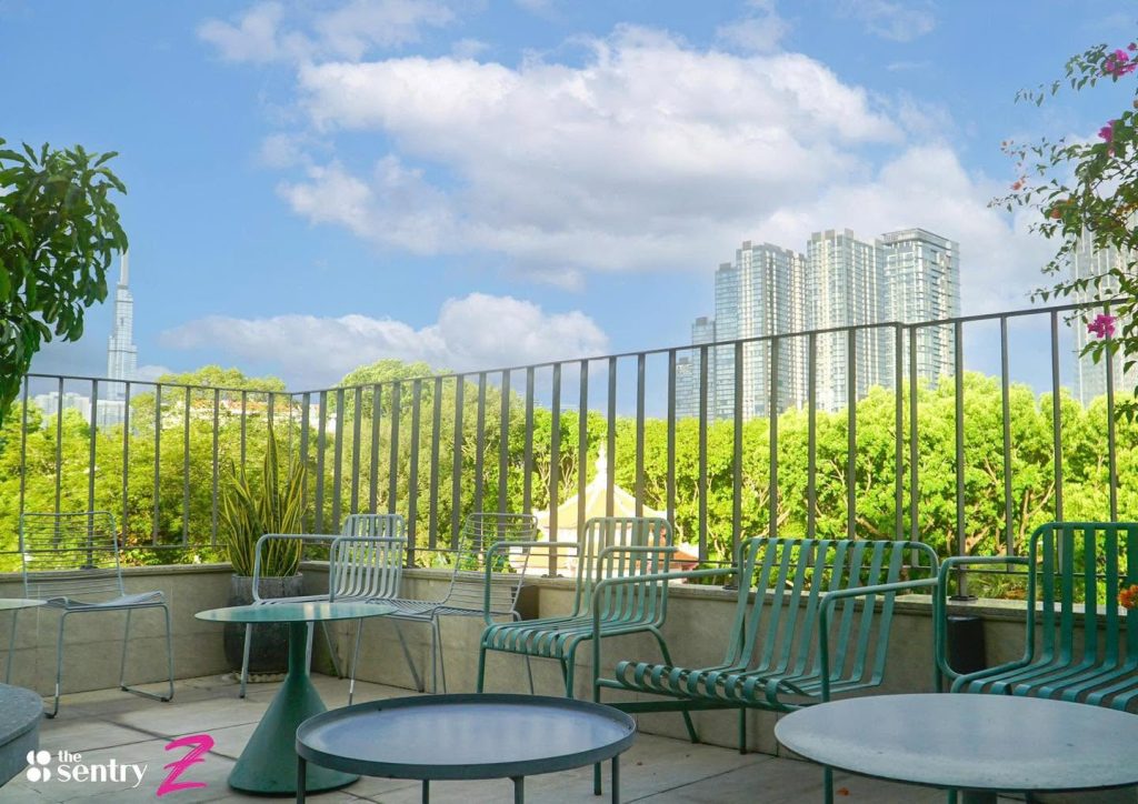 The Sentry coworking common area with communal seating and greenery