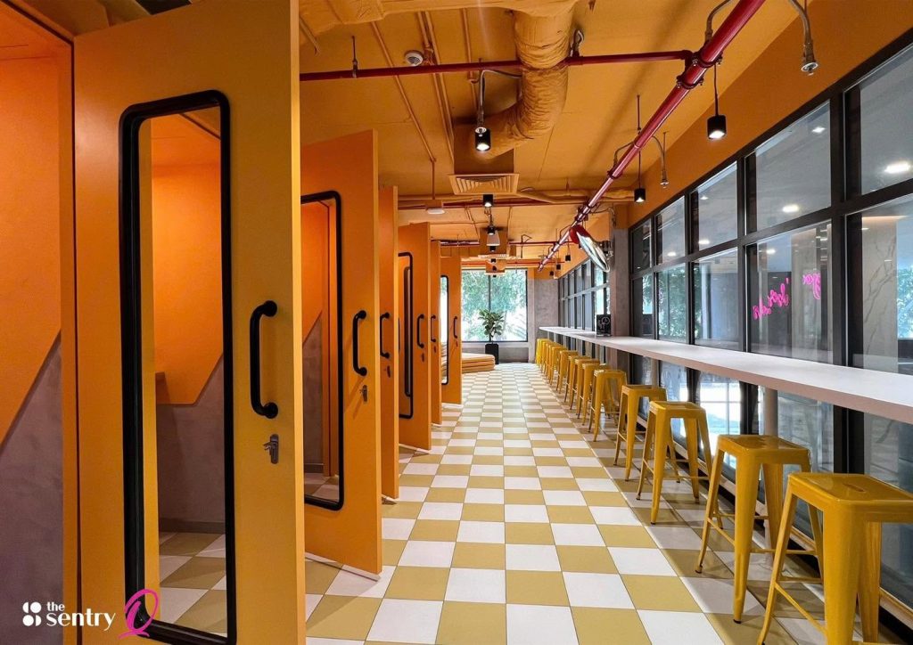 Bright meeting room and soundproof call booth at a The Sentry location.