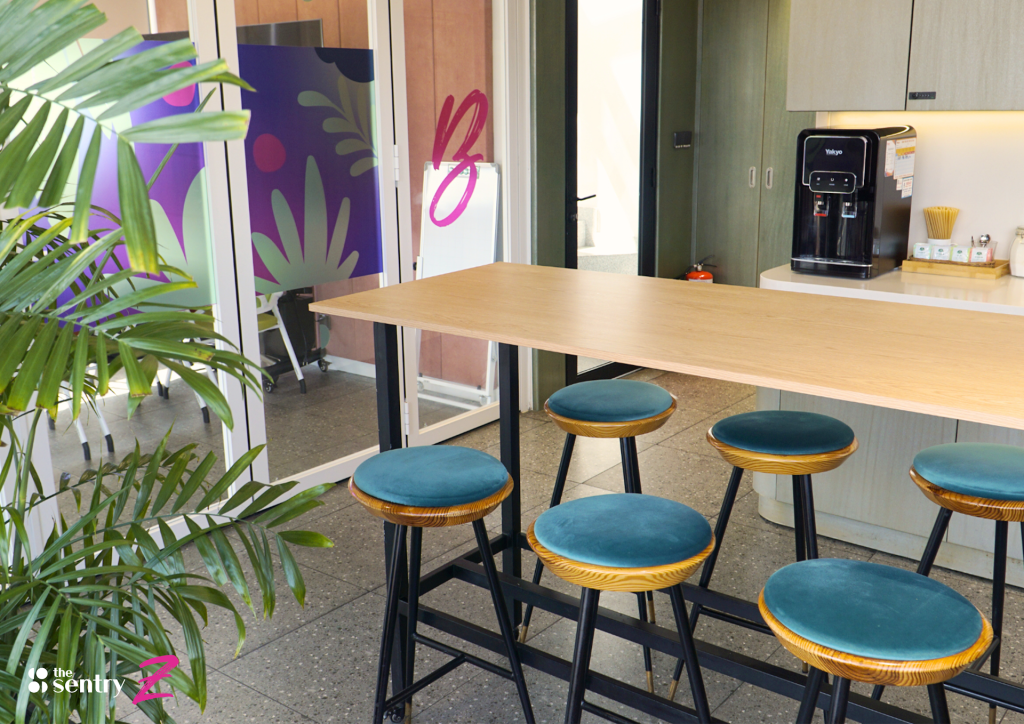 Pantry and lounge area with seating at The Sentry coworking space