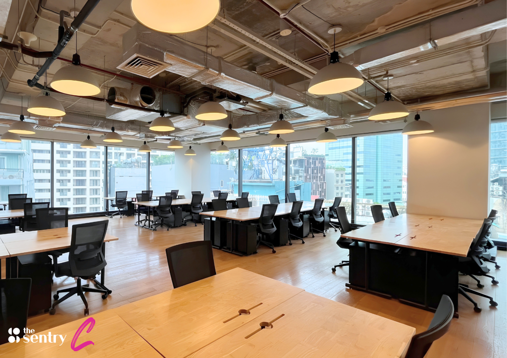 Private office suite with desks and chairs at The Sentry