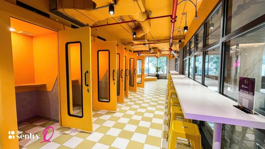 Row of soundproof phone booths along a corridor at The Sentry