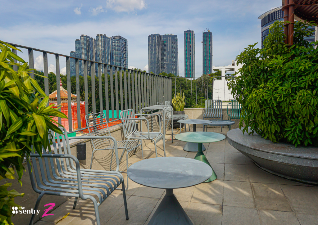 Green wall of plants beside a seating area at The Sentry